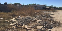 Lleno de basura lote baldío en Capistrano Residencial