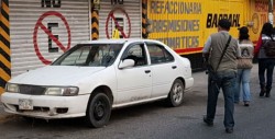 Localizan restos humanos dentro de automóvil