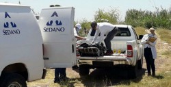 Encuentran ejecutado a balazos en caja de camioneta