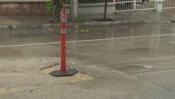 Precaución por bache en Ciudades Hermanas