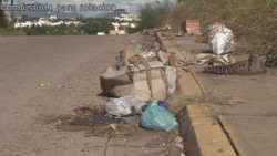 Lote baldío convertido en basurero