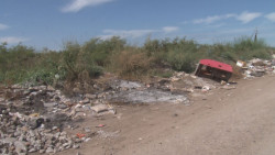 Lote baldío lleno de basura en Cedros